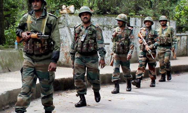 Army patrols a street following clashes between police and
