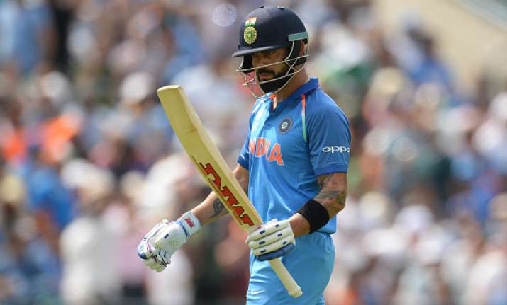 Virat Kohli of India leaves the field after being dismissed