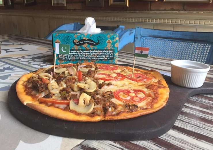 Food for thought Karachi bakery’s ‘LoC’ pizza is half Indian and half