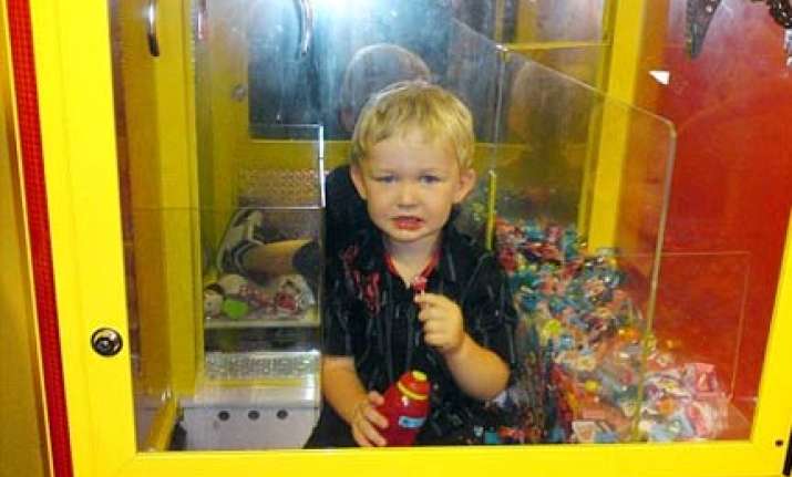 australian toddler trapped inside lolly machine while