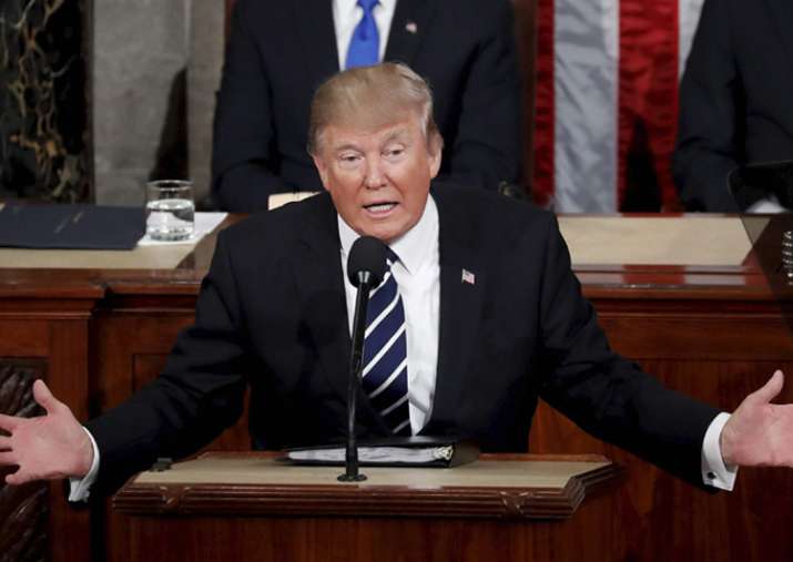 Federal judge halts new travel ban; Trump calls it
