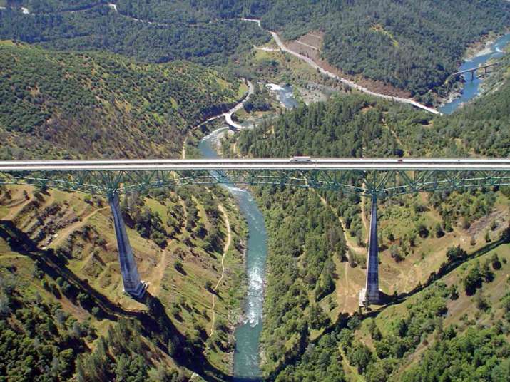 Woman falls off tallest California bridge while taking