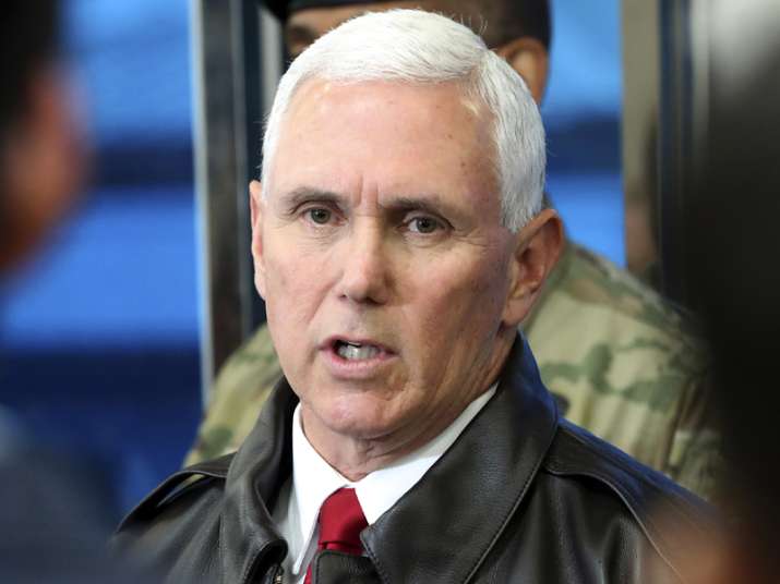 Mike Pence speaks to the media at border village of