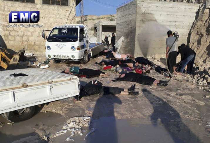 Russia defends ally Assad as death toll in Syria chemical