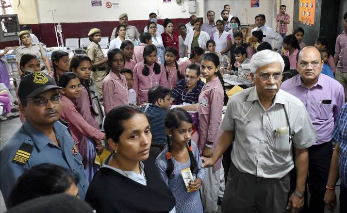 Schoolgirls being treated at a hospital in New Delhi after