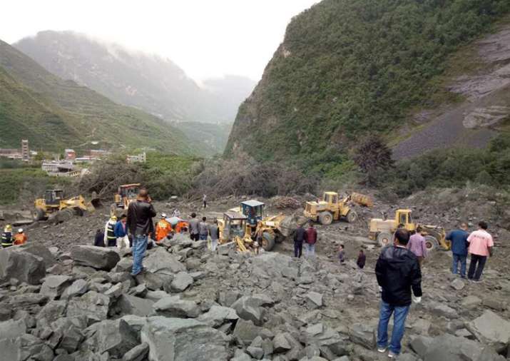 Over 100 people feared buried in southwest China landslide