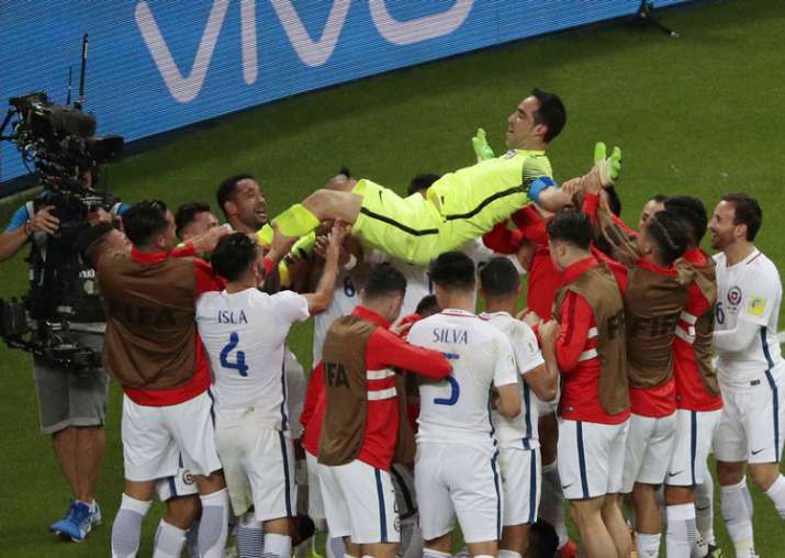 Chile players celebrate their win against Portugal in