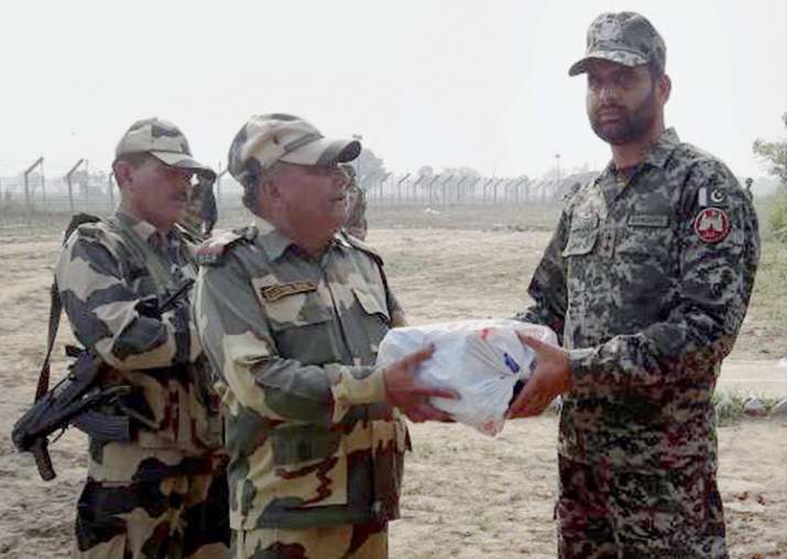 Jammu: BSF personnel exchange sweets with a Pakistan