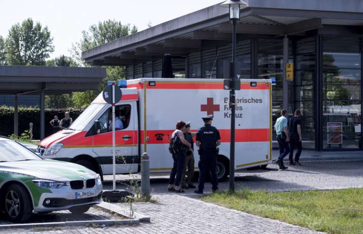An ambulance stands near a subway station in Munich after
