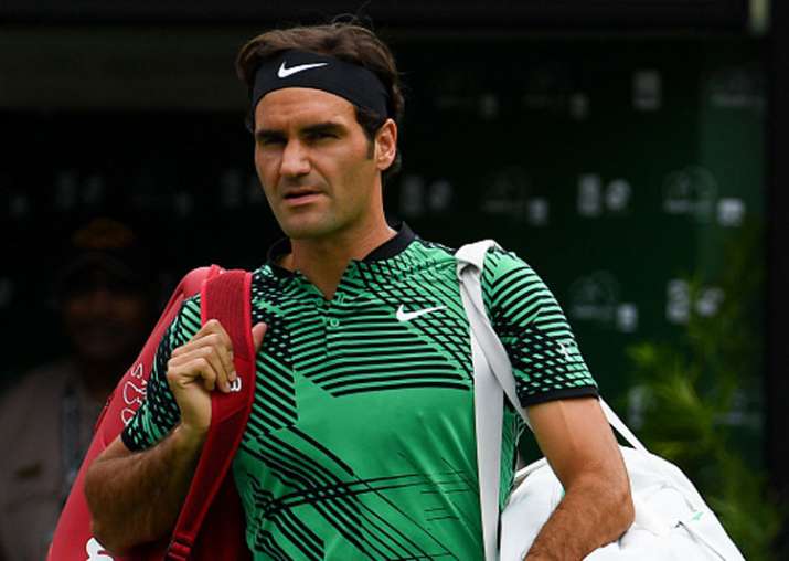 Roger Federer of Switzerland walks onto the court