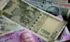 Rupee crashes to over 2-month low on foreign fund outflows