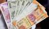 Rupee rises 21 paise to 69.49 against USD in early trade.