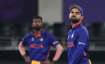 India's captain Virat Kohli reacts to a boundary hit by New Zealand's Daryl Mitchell during the Cric