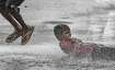 New Delhi: Boys play on a waterlogged road amid monsoon