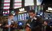 Traders work on the floor at the New York Stock Exchange in