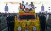 Prime Minister Narendra Modi waves at supporters as he