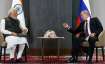 Russian President Vladimir Putin and Prime Minister Narendra Modi attend a meeting on the sidelines 