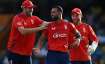 Saqib Mahmood celebrates a wicket with teammates Jamie Overton and Phil Salt.