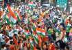 People participate in a Tiranga Yatra organised as part of