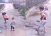 Kid piggybacks his siblings to cross waterlogged road
