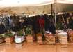 People attend the burial ceremony of some of the people who