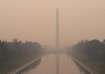 The Washington Monument in a thick layer of smoke in