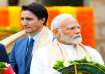 Canada's Prime Minister Justin Trudeau (left) walks past