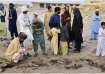 Local residents at the site of Mastung suicide blast in