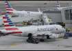 US, man tries to open door, plane, American Airlines