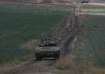 Israeli Defense Forces tank drives away from Gaza  Strip. 
