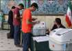 Iranians voting in the runoff parliamentary elections in