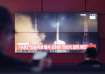 TV screen shows an image of North Korea's rocket launch in