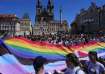 People march during the LGBTQ+ parade at the Old Town Square in Prague, Czech Republic