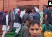 Akhilesh Yadav shakes hands with Amit Shah outside Parliament