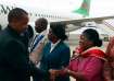 Malawi Vice President Saulos Chilima, left, greets government officials upon his return from South K