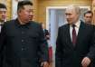 Russian President Vladimir Putin talks with North Korean leader Kim Jong Un during his visit to Pyon