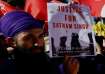 A Sikh demonstrator attends a protest called by the Italian trade union CGIL following the death of 