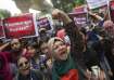 University students shout slogans during a protest to