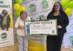 Donna Osborne, 75, left, posing for a photo with PA Lottery Deputy Director of Corporate Sales Staci