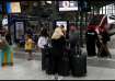 Passengers are pictured at Gare du Nord station after