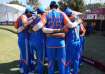 Team India in a huddle.