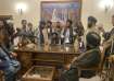 Taliban fighters take control of the Afghan presidential palace after Afghan President Ashraf Ghani