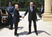 Azerbaijani President Ilham Aliyev, right, greets Russian President Vladimir Putin at Zagulba state 