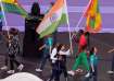 Manu Bhaker and PR Sreejesh with India's flag.