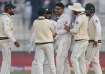 Abrar Ahmed celebrates a wicket with his teammates.