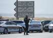 Israeli police stand guard near the site of a deadly shooting attack where Israeli officials say thr