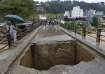 A bridge over Bagmati River lies damaged due to floods caused by heavy rains in Kathmandu