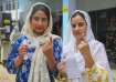 Kashmiri women after casting their votes in the recently