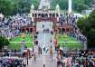 Visitors watch security personnel perform during the beating retreat ceremony at the Attari-Wagah Bo