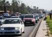 People in heavy traffic drive north from Lebanon's southern coastal city Sidon as some of them flee 